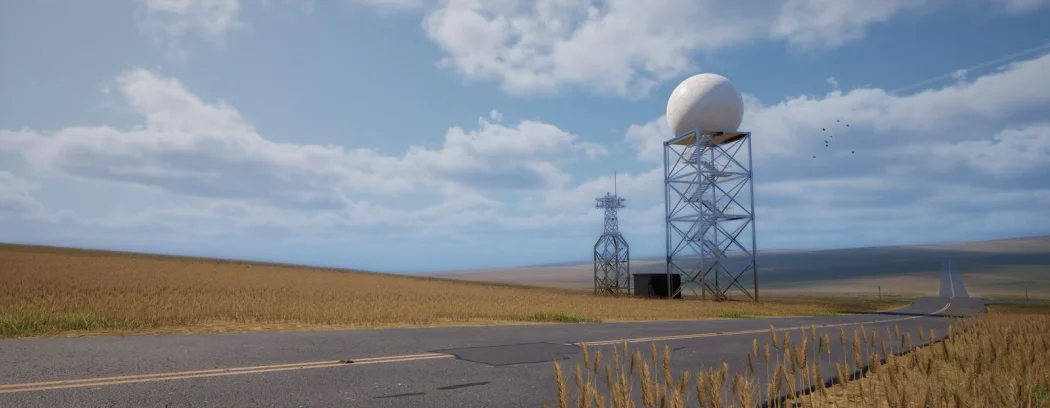 A Doppler radar tower beside a two-lane road through open wheat field