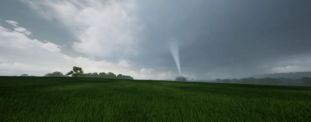 A slender tornado over open farmland, dust cloud at its base under a heavy grey storm