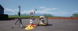 Three weather probes of different designs set out in a parking lot